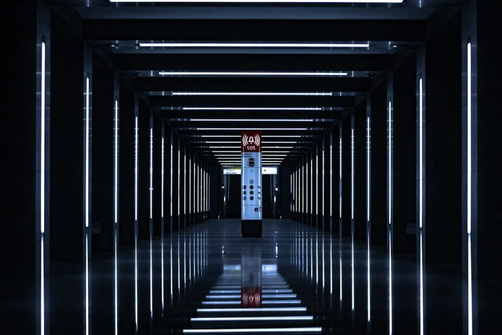 a long hallway with a clock on the wall