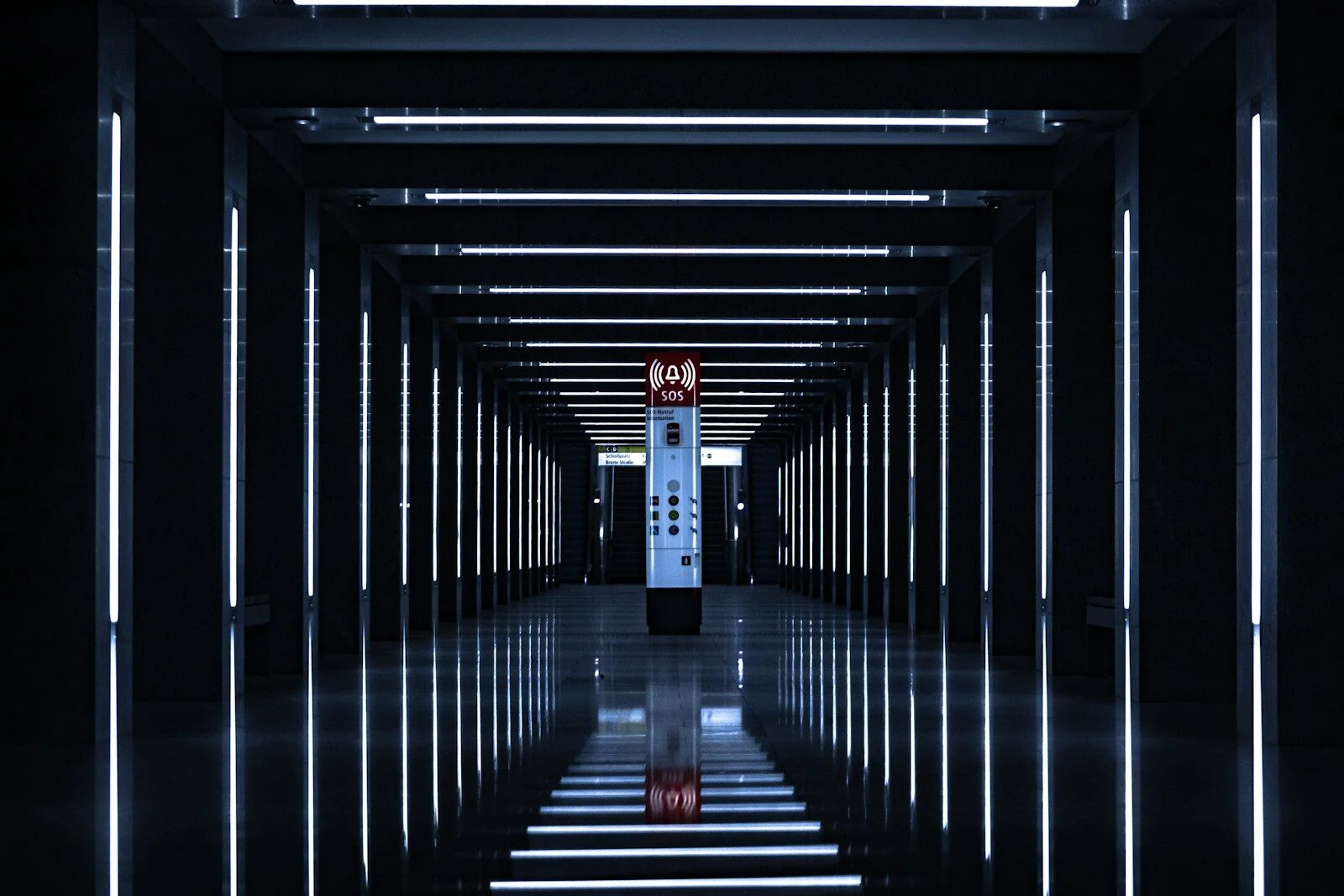 a long hallway with a clock on the wall