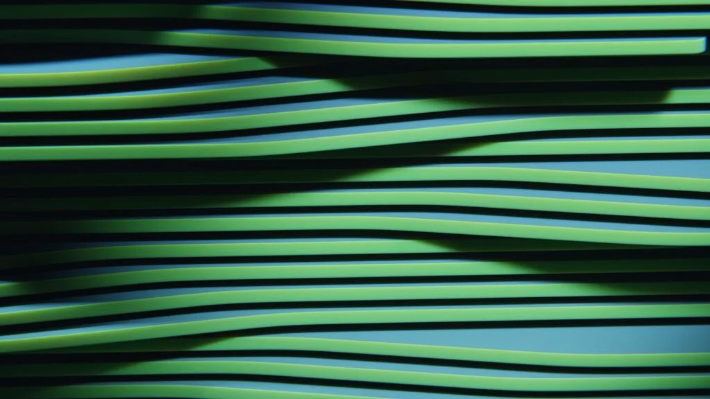 Green wavy lines with shadows creating an abstract pattern.