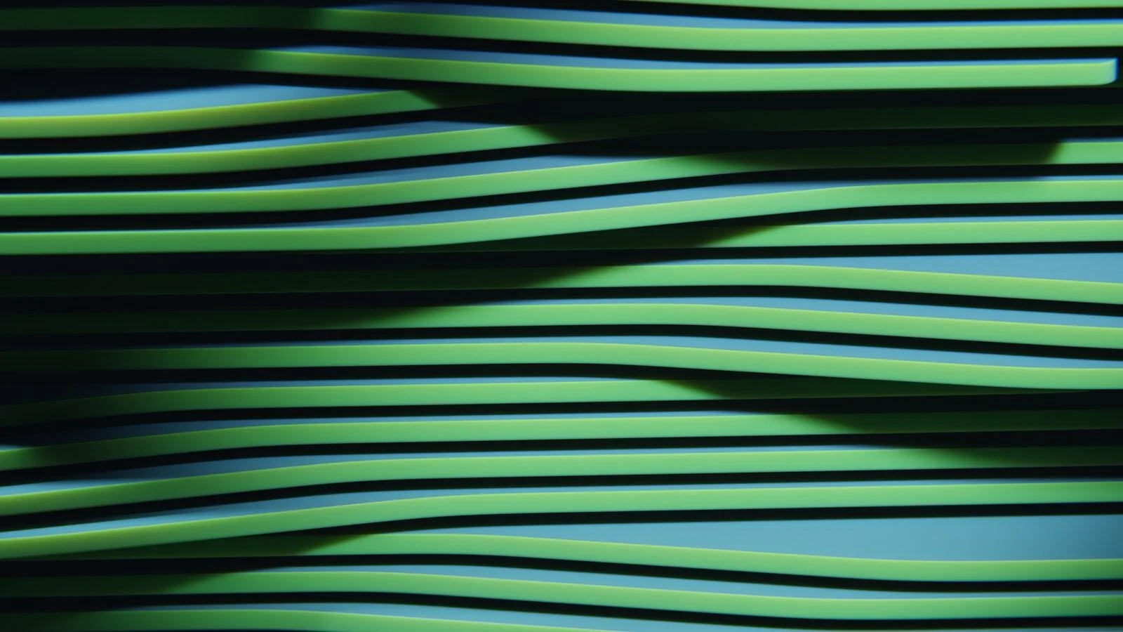 Green wavy lines with shadows creating an abstract pattern.