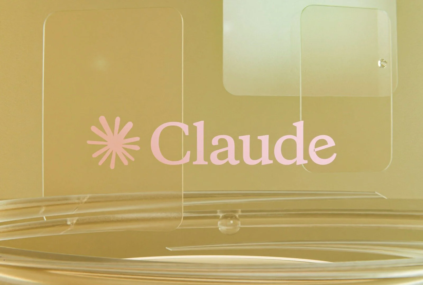Pink claude logo on a golden background with clear elements.