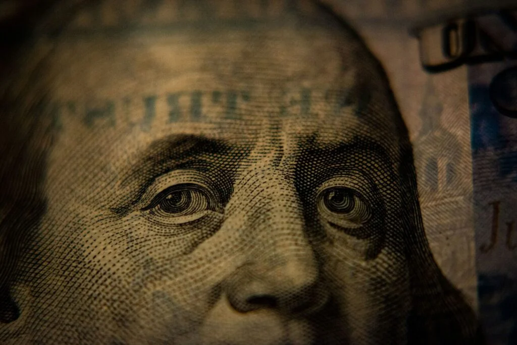 A close-up of Benjamin Franklin on a United States one hundred dollar bill
