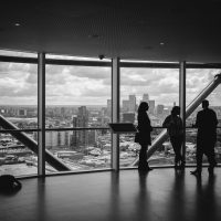 people standing inside city building